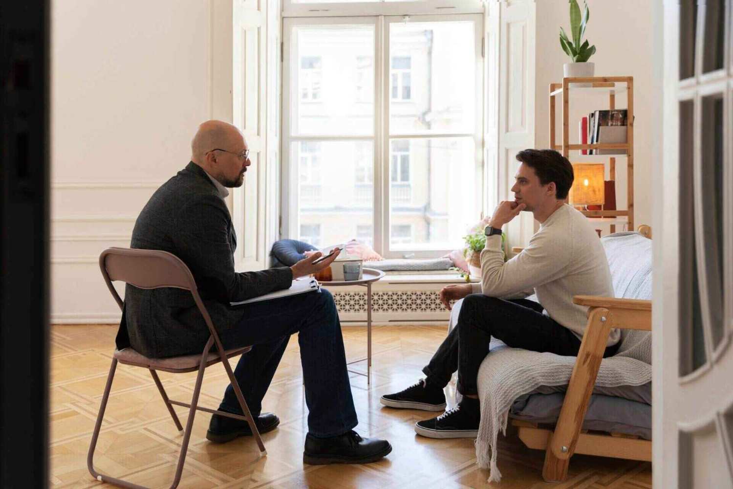 two people sitting in front of each other